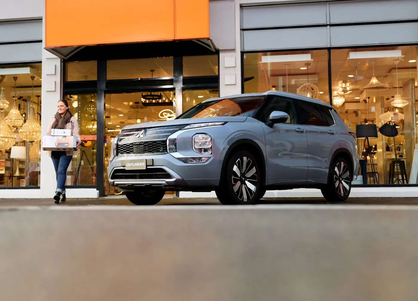 New 2025 Mitsubishi Outlander parked in an urban setting