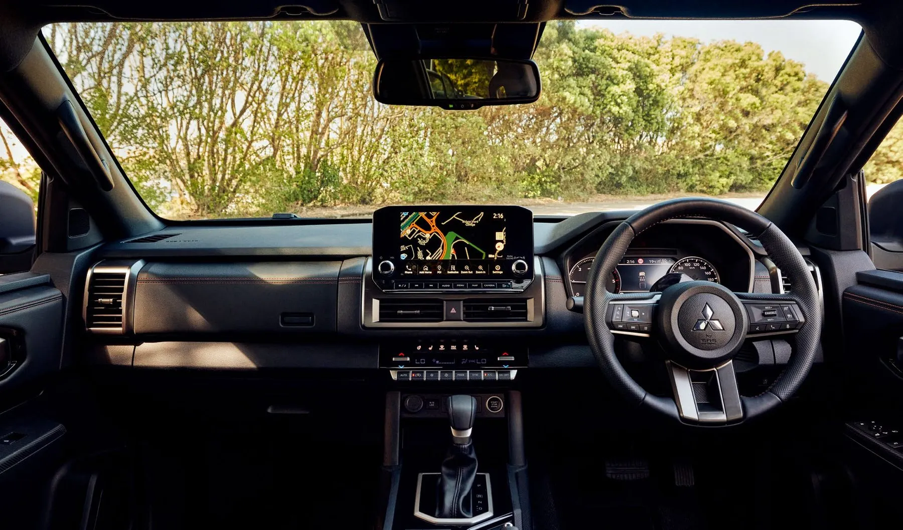 Triton interior with 9-inch display and leather steering wheel