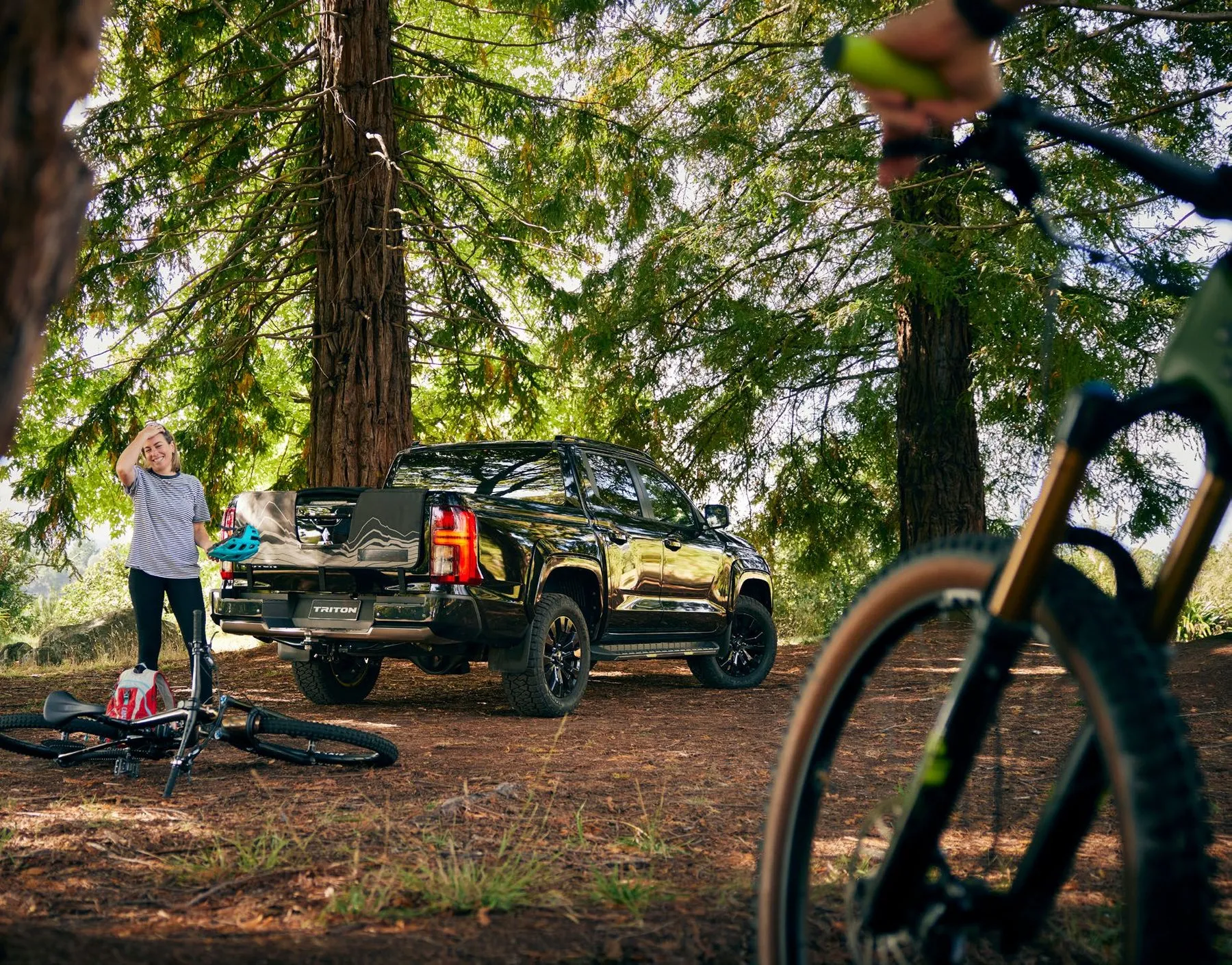 Mitsubishi Triton parked in a forest