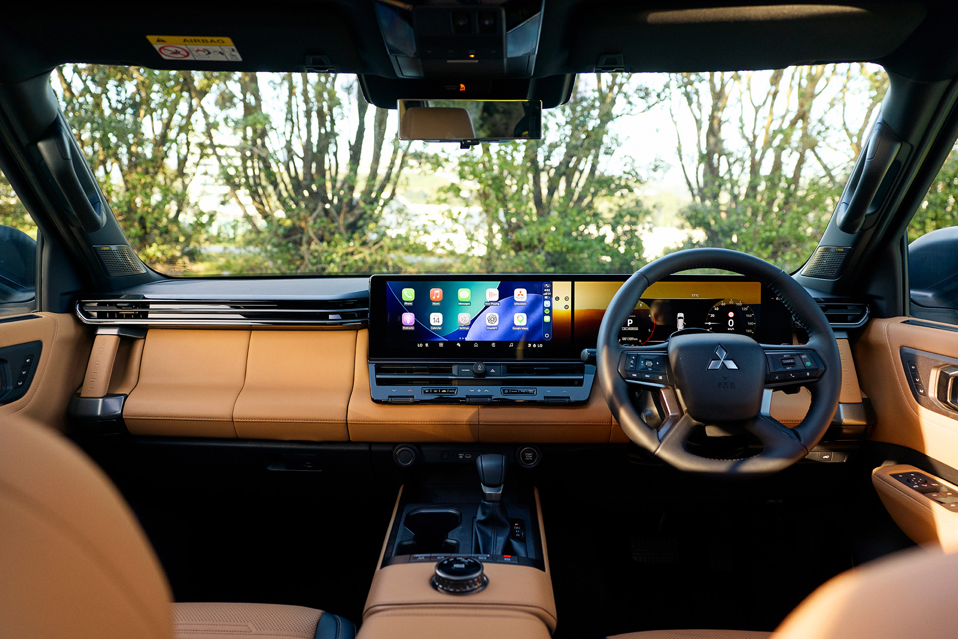 Pajero Exceed cabin with monolithic display and tan leather trim