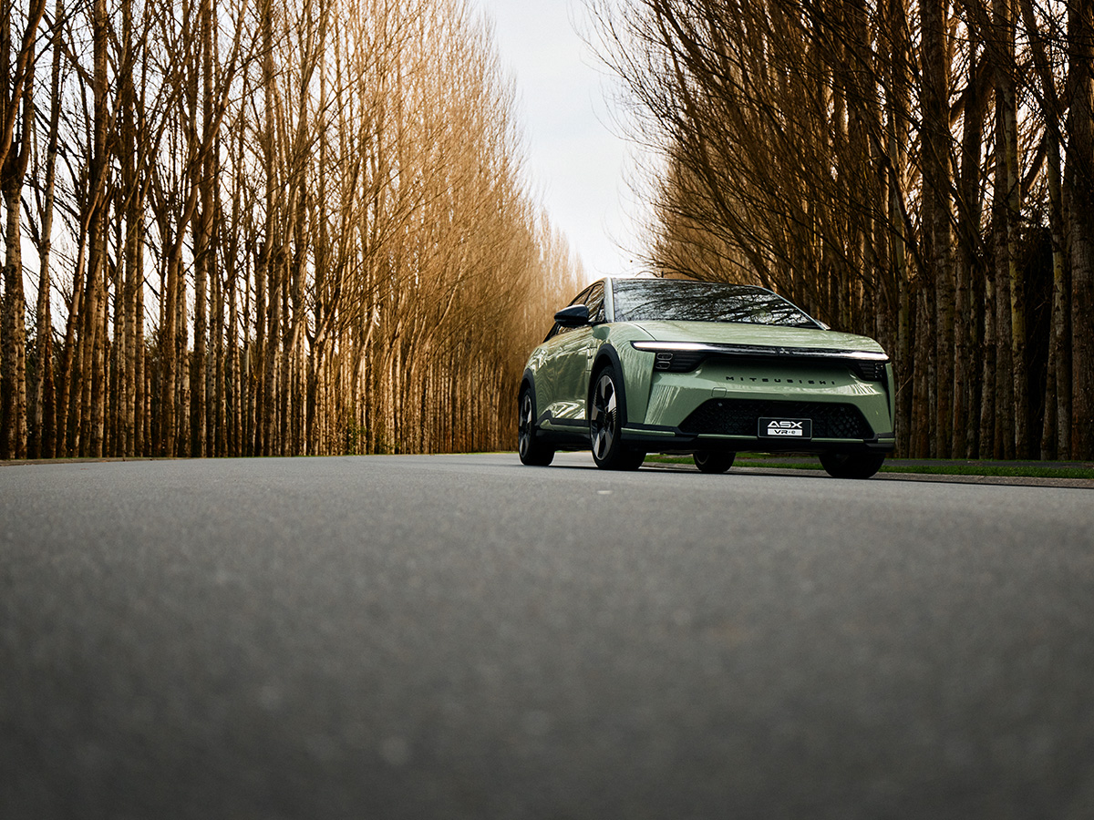 Mitsubishi ASX VR-e driving on a tree-lined road